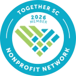 Circular blue badge with white text reading “Together SC Nonprofit Network.” In the center, “2026 Member” appears above a stylized heart made of green and blue geometric shapes.